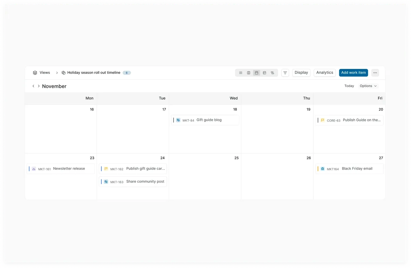 Saved Calendar view showing scheduled Holiday season campaign deliverables.